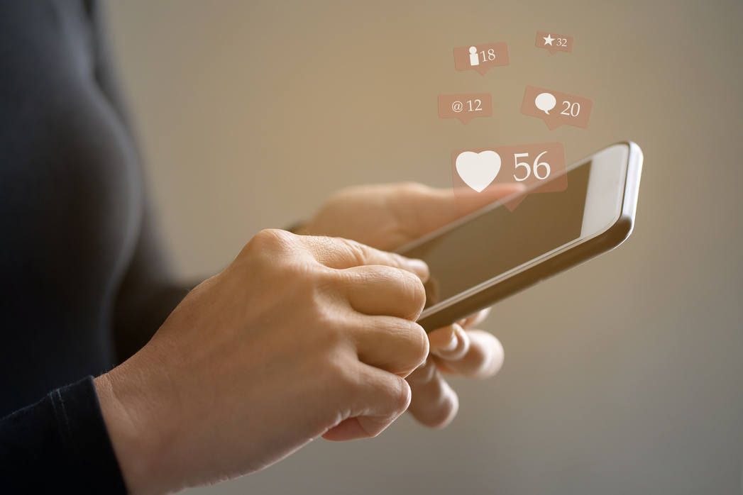 Woman hand using smart phone for social media and ecommerce concept